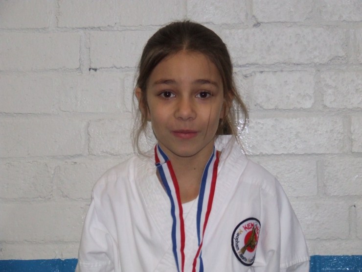 Ashleigh Wise collecting her silver medal with a very strange smile